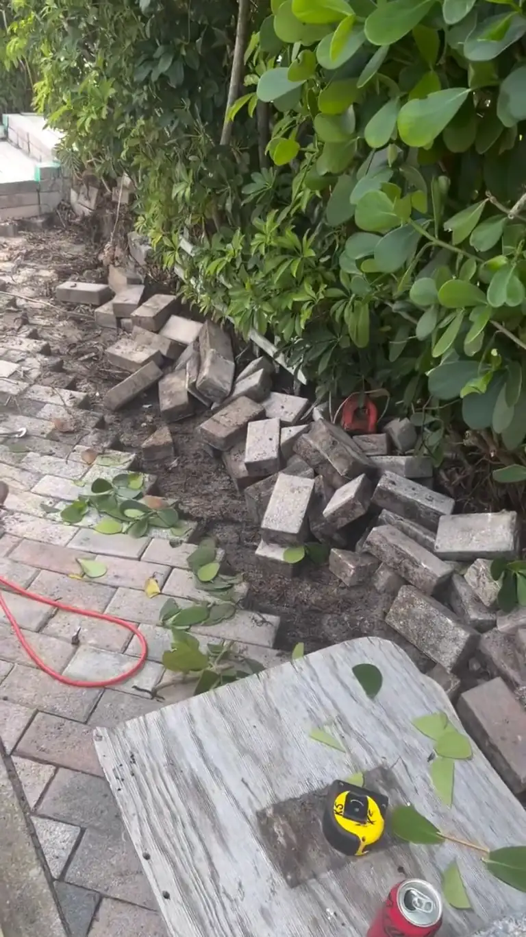 Cracked concrete patio before removal