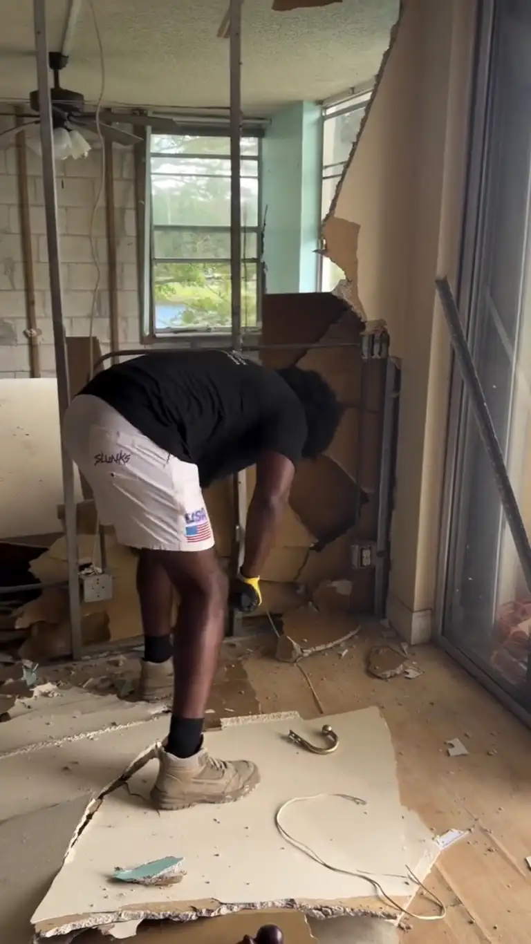 Crew pulling out drywall and fixtures