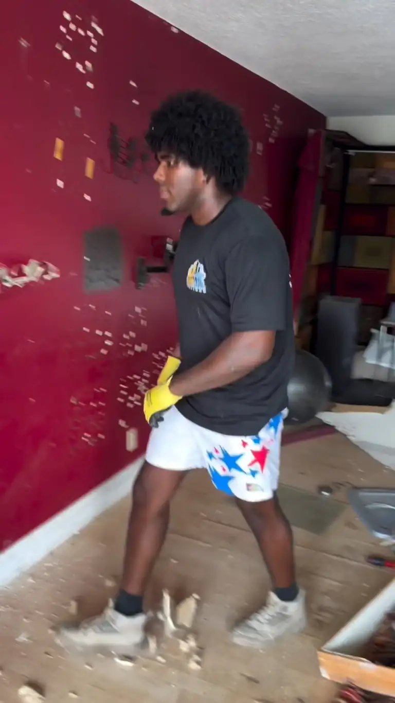 Crew tearing out drywall in a house after the clean-out