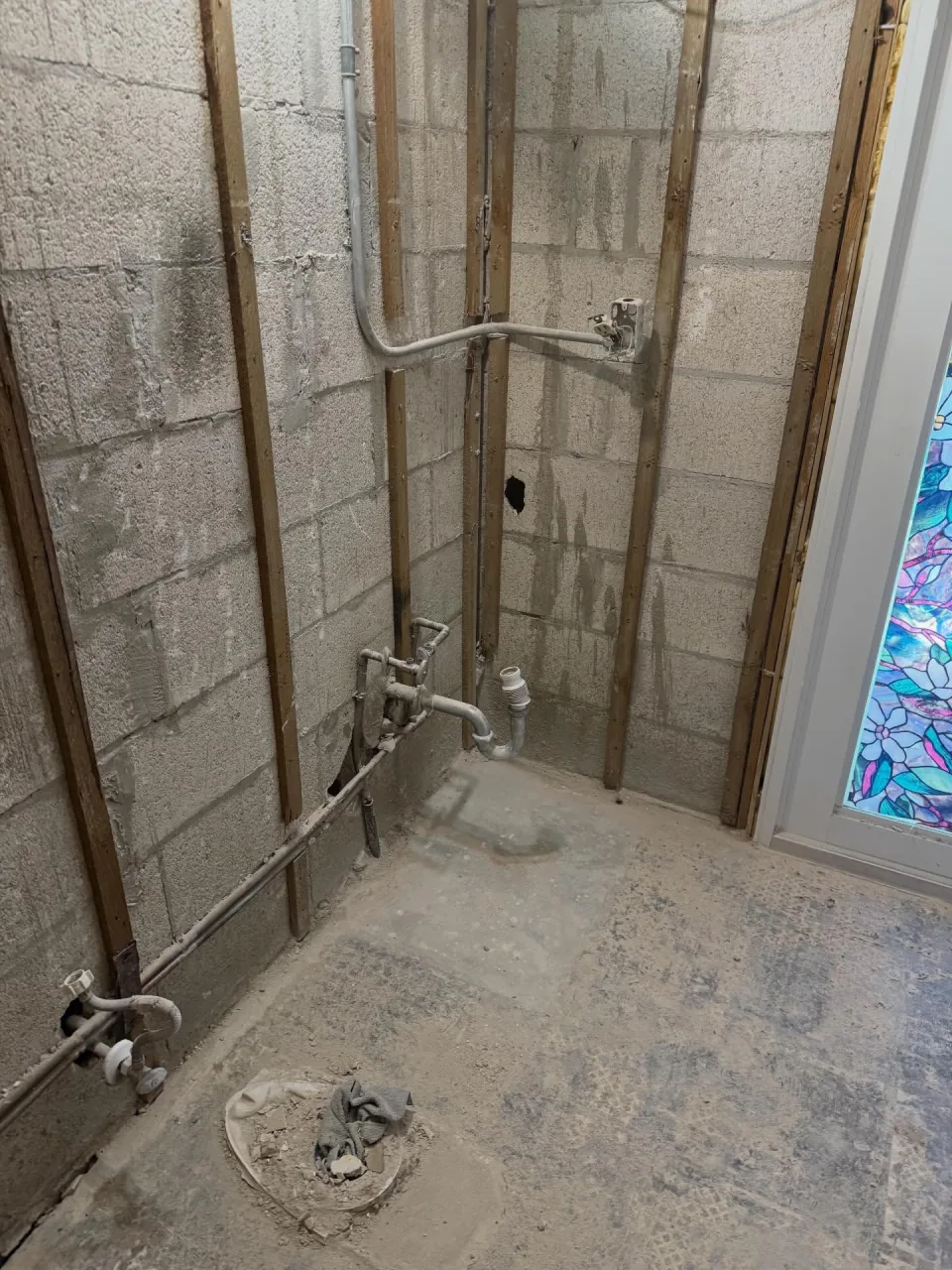 Framed wall and plumbing exposed