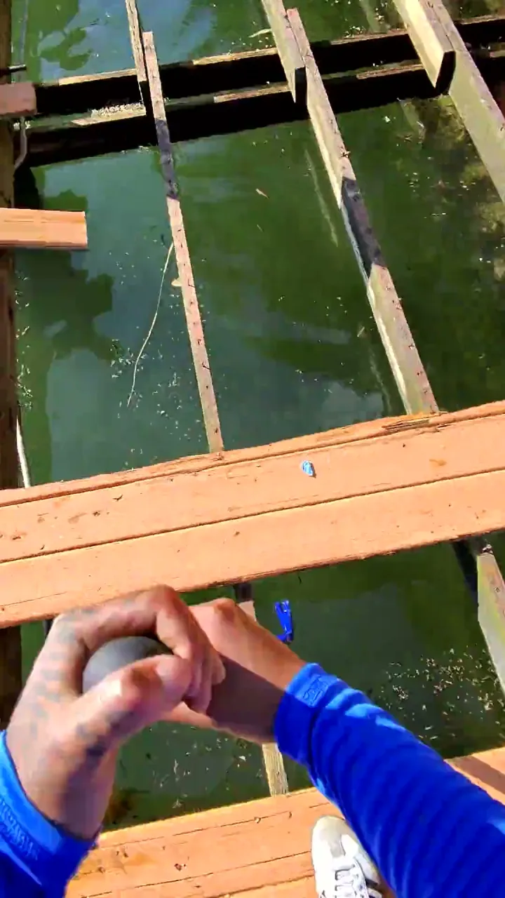 Time-lapse of the crew taking apart a wooden dock by the water